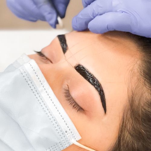 Brow henna product applied to client's eyebrows.