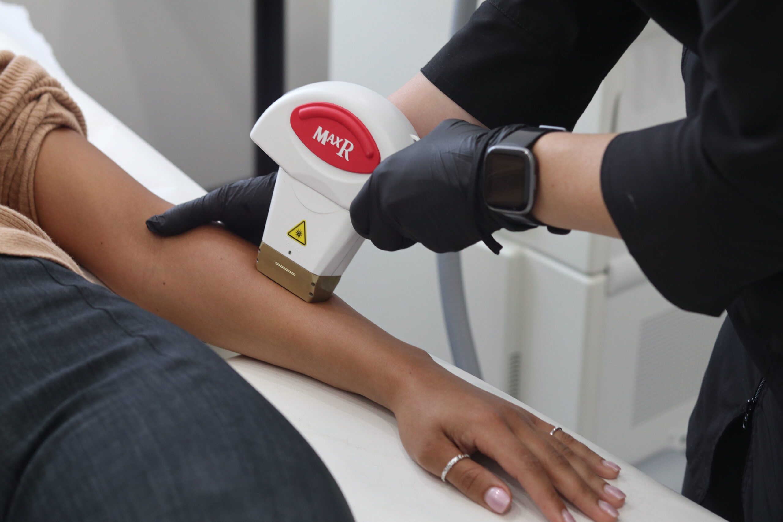 Laser hair removal training course. Student training on arm