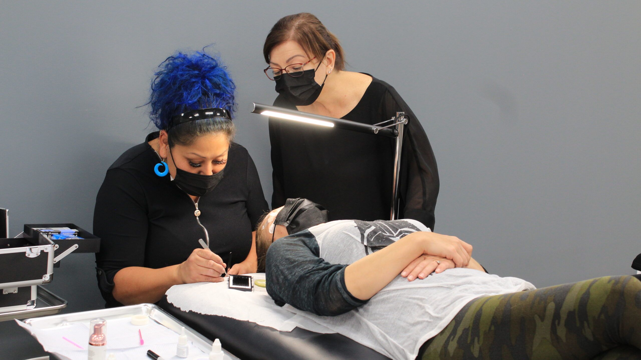 Lash extension course student practising on model