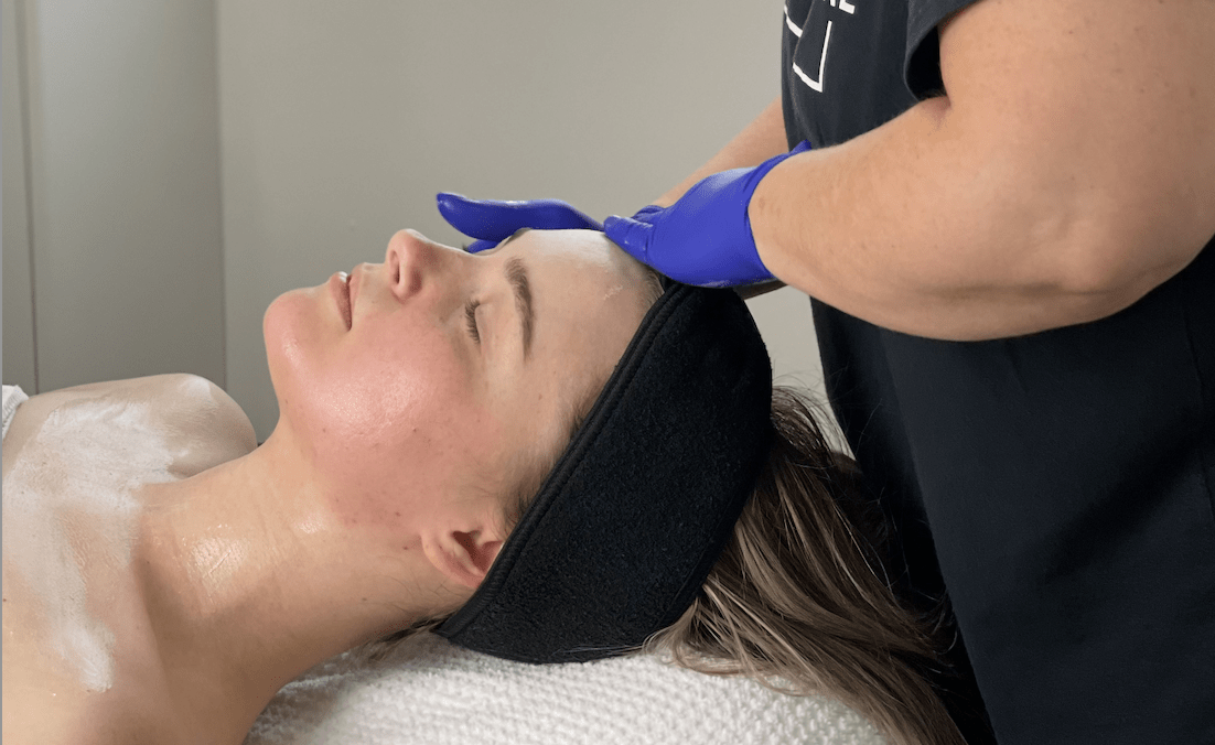 model getting a facial massage