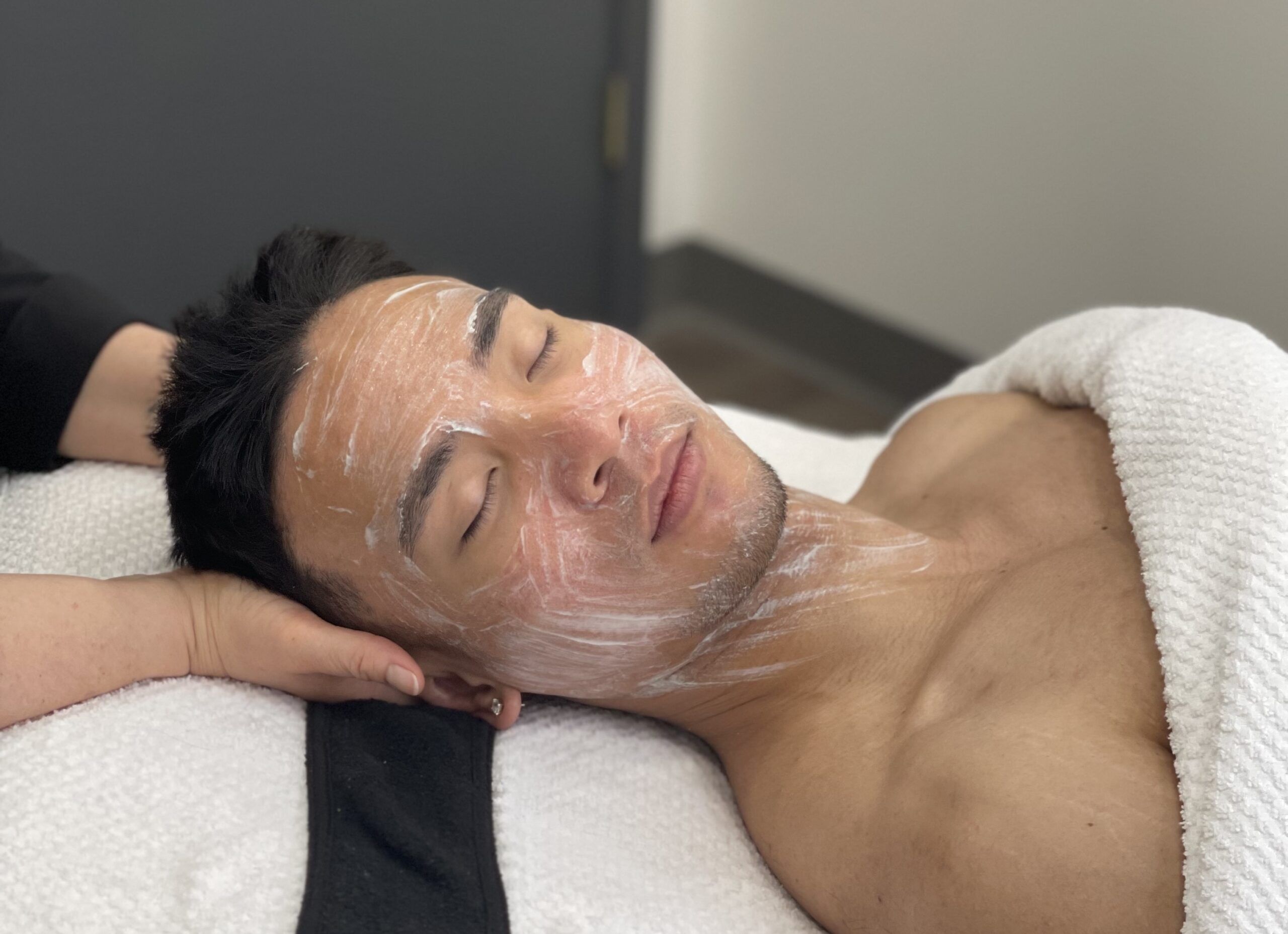 male model getting a facial