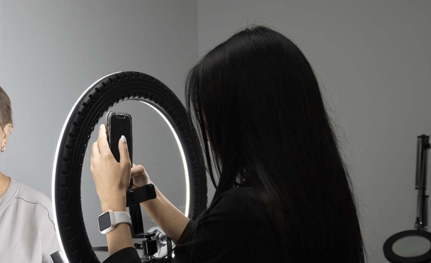 "esthetician taking client pictures"