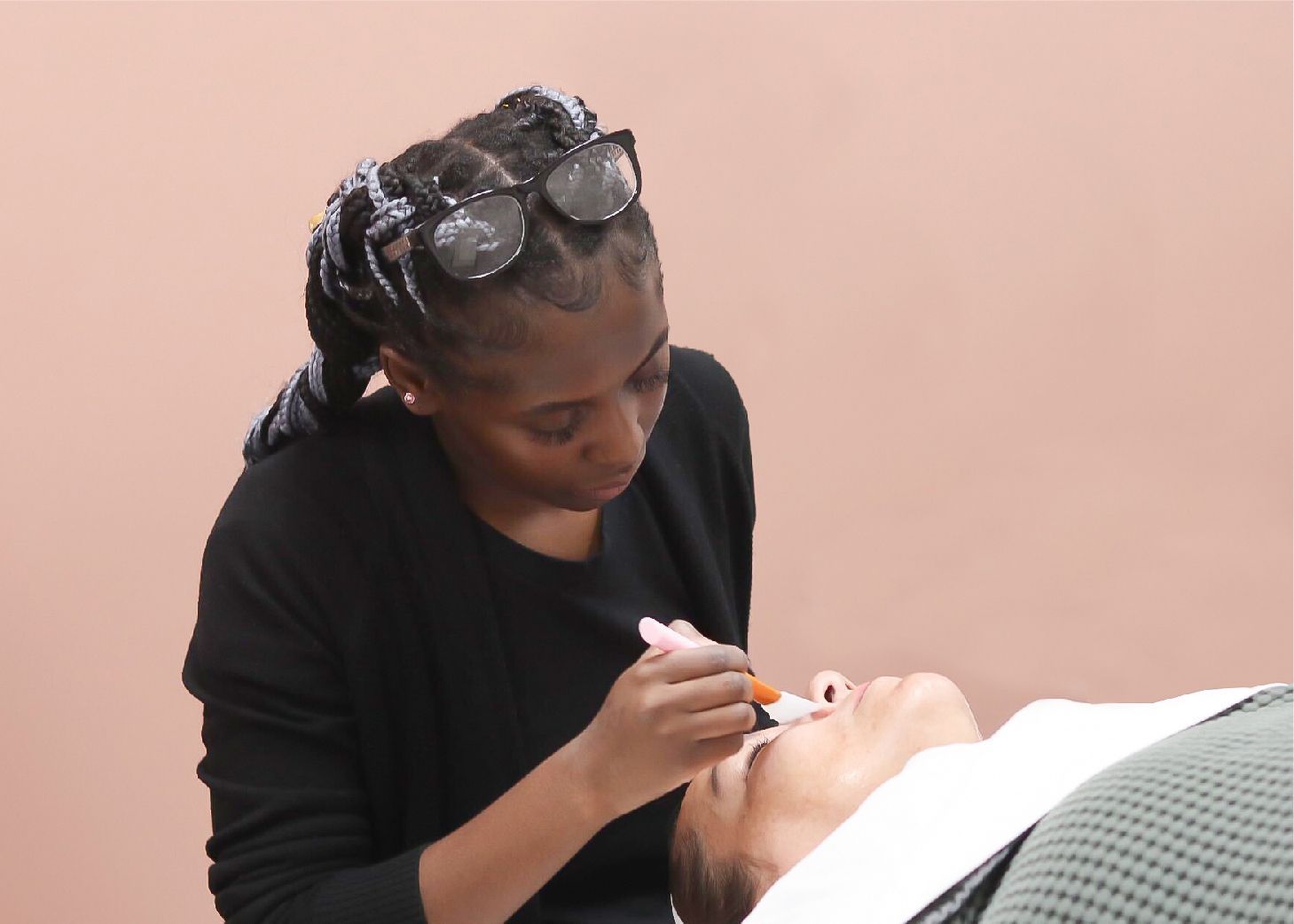 Model receiving facial massage at Wrapture Beauty Academy