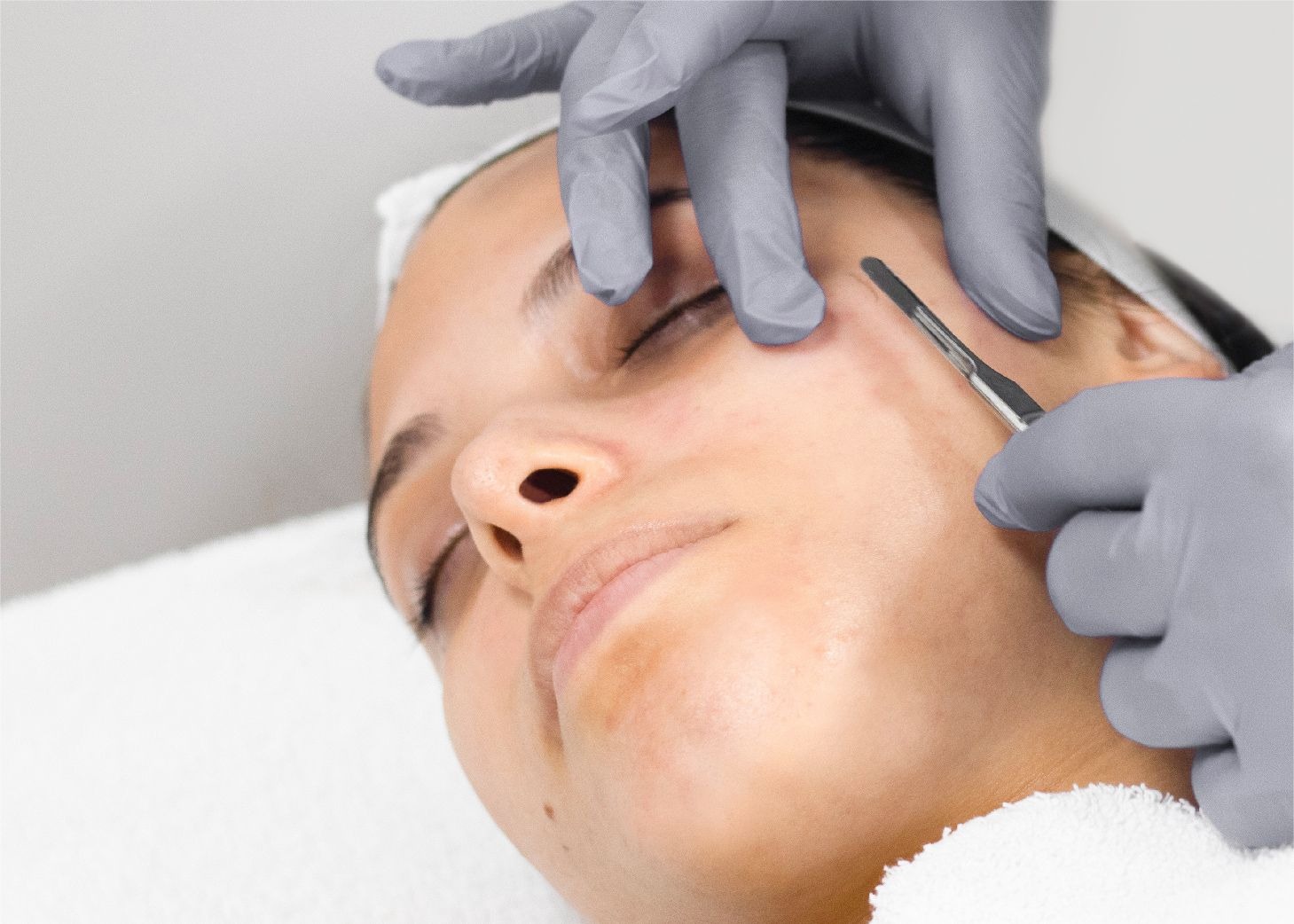 Model receiving facial massage at Wrapture Beauty Academy