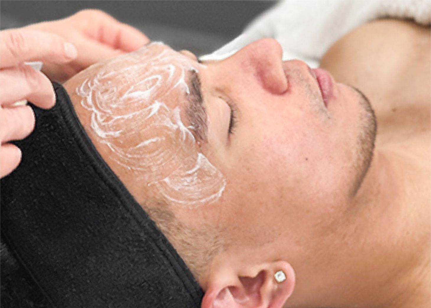 Model receiving facial massage at Wrapture Beauty Academy