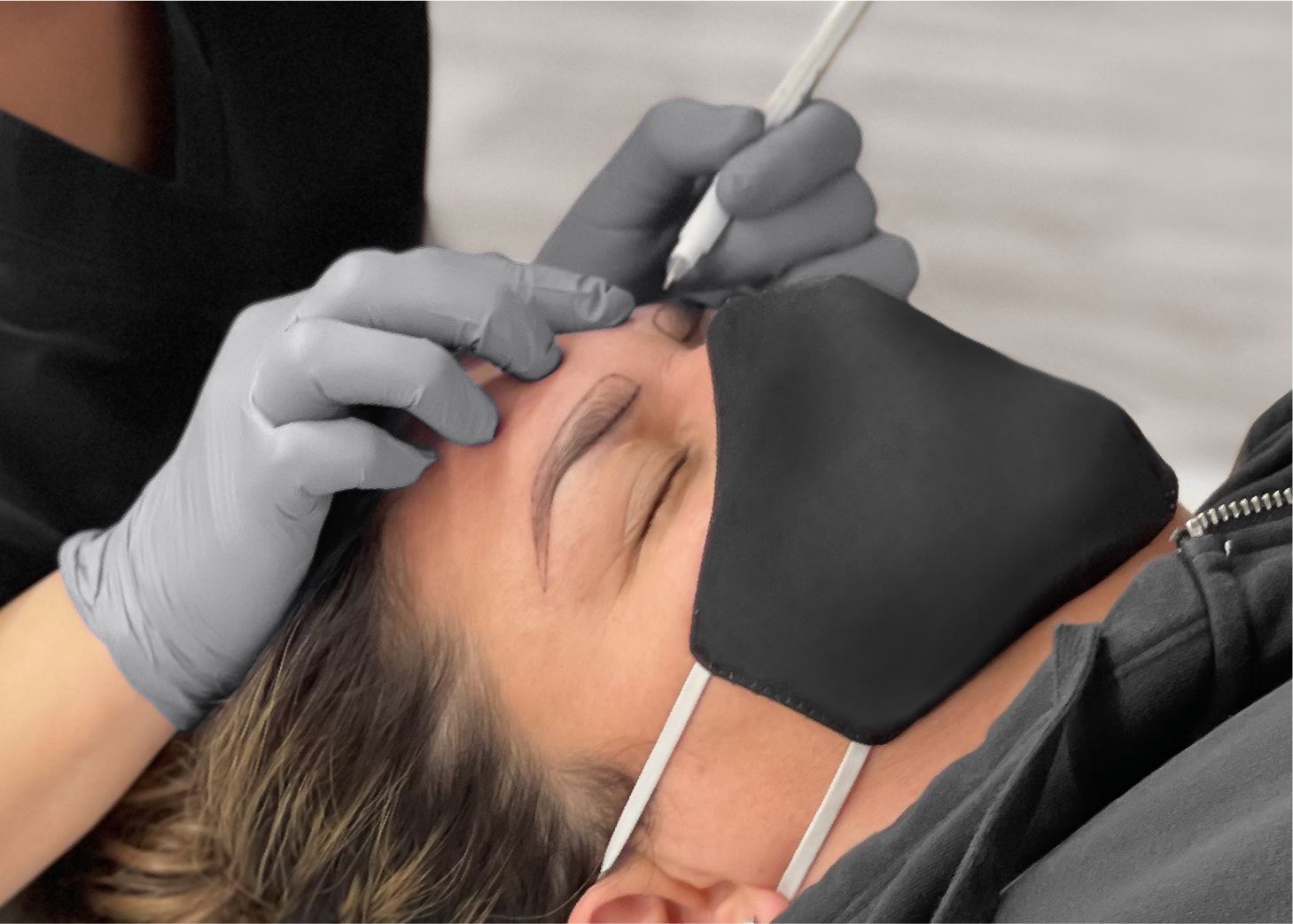 Student mapping brow shape on client