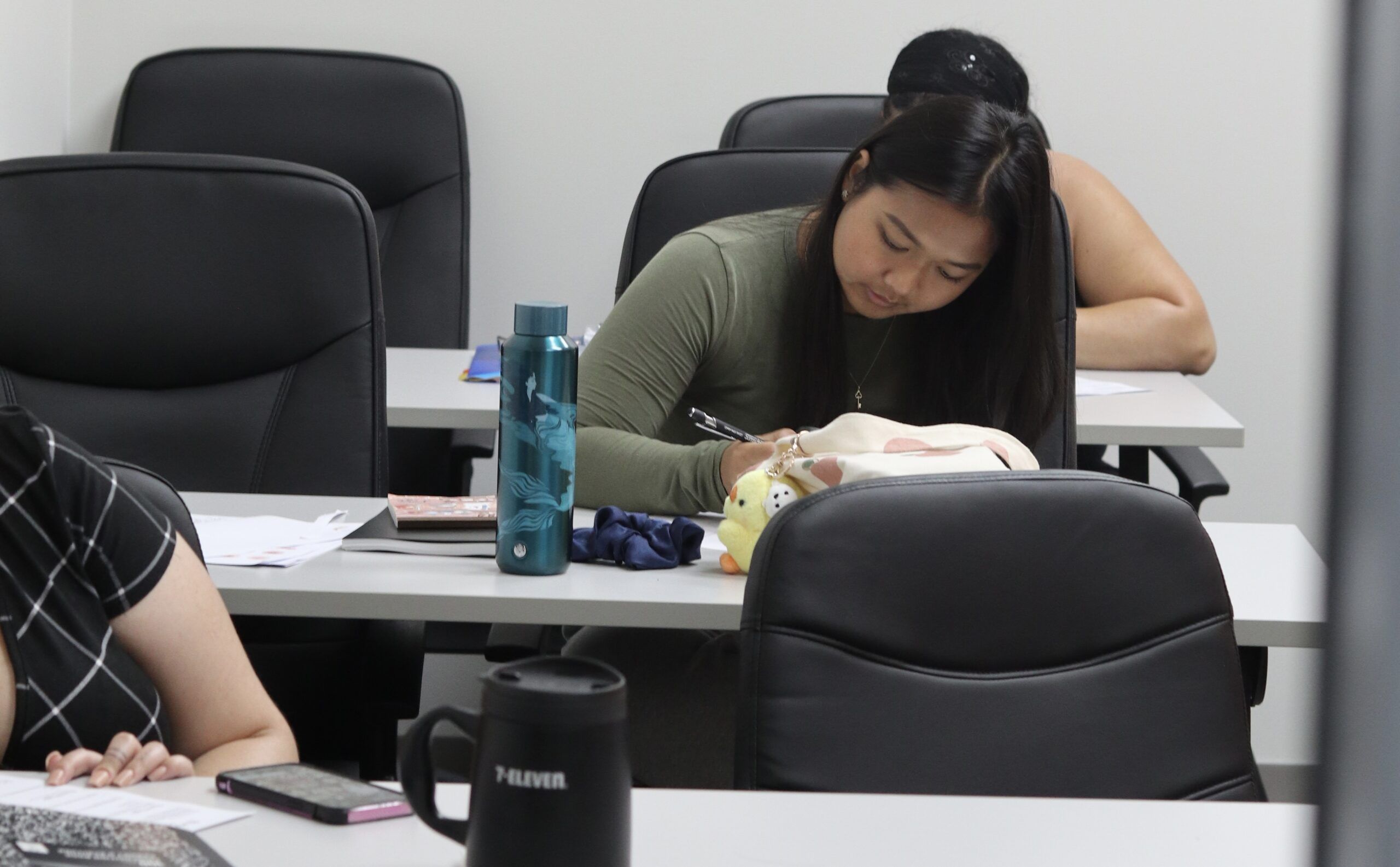 "Future esthetician learning advanced facial massage techniques"