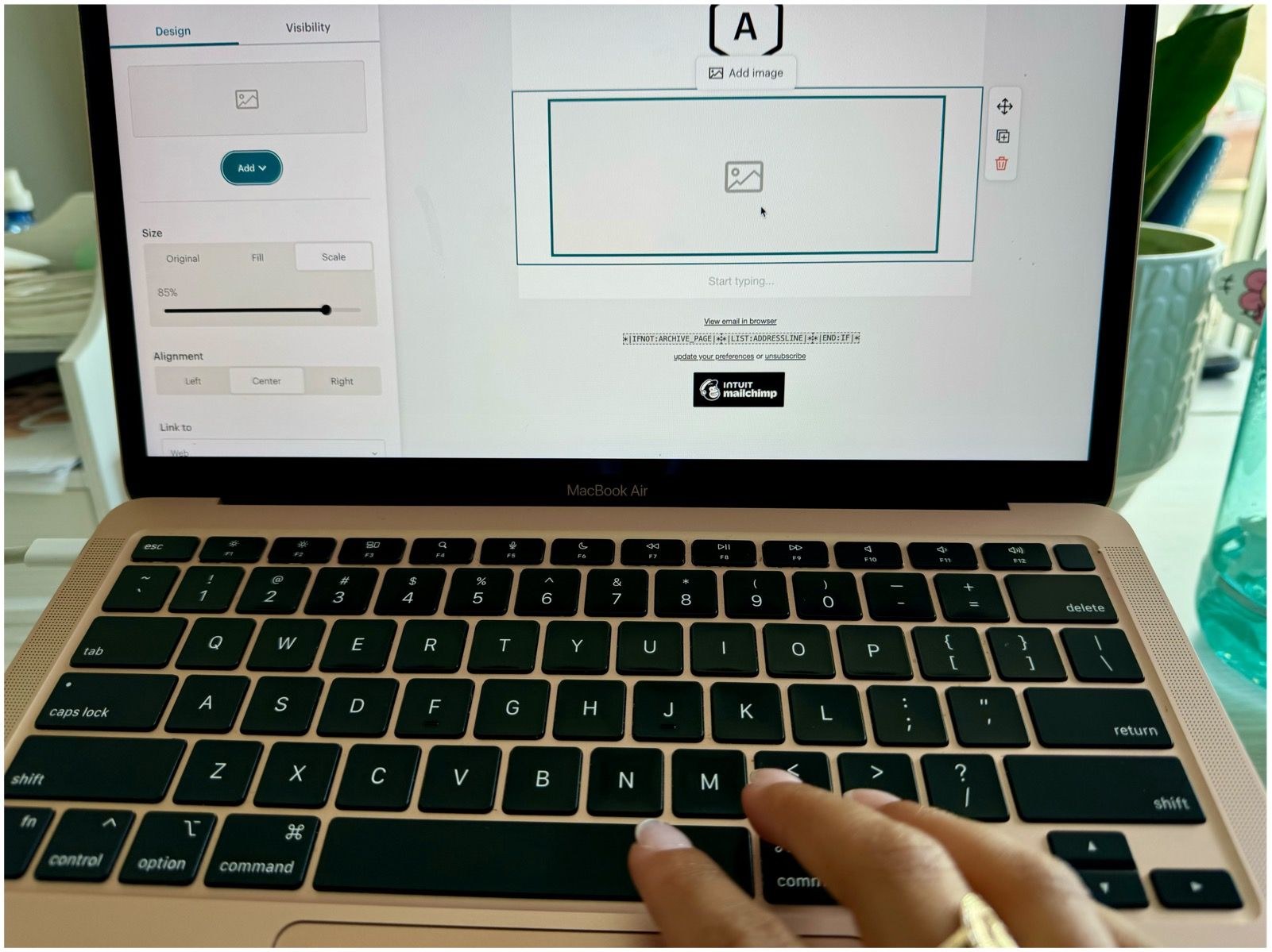 “Esthetician designing a visually appealing email for beauty product promotions”