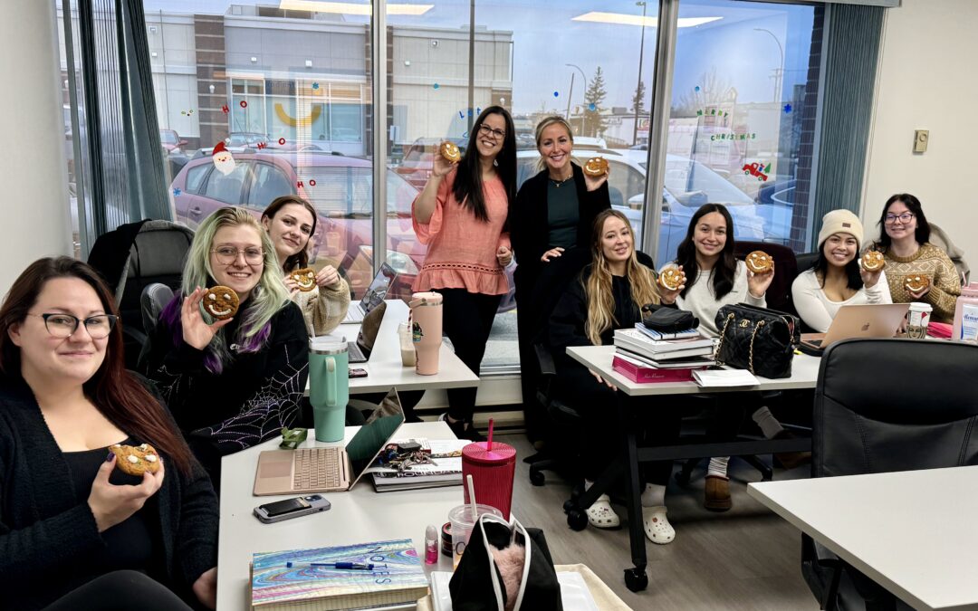 Kelsey's classroom with students holding up smile cookies for the cheer board fundraiser. A great community moment