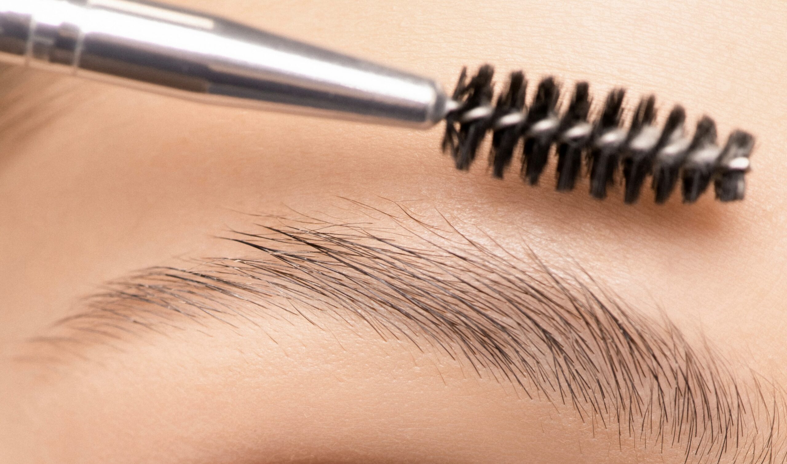 A person temporarily laminating her brows before she started studying at a Beauty School in Winnipeg, Manitoba