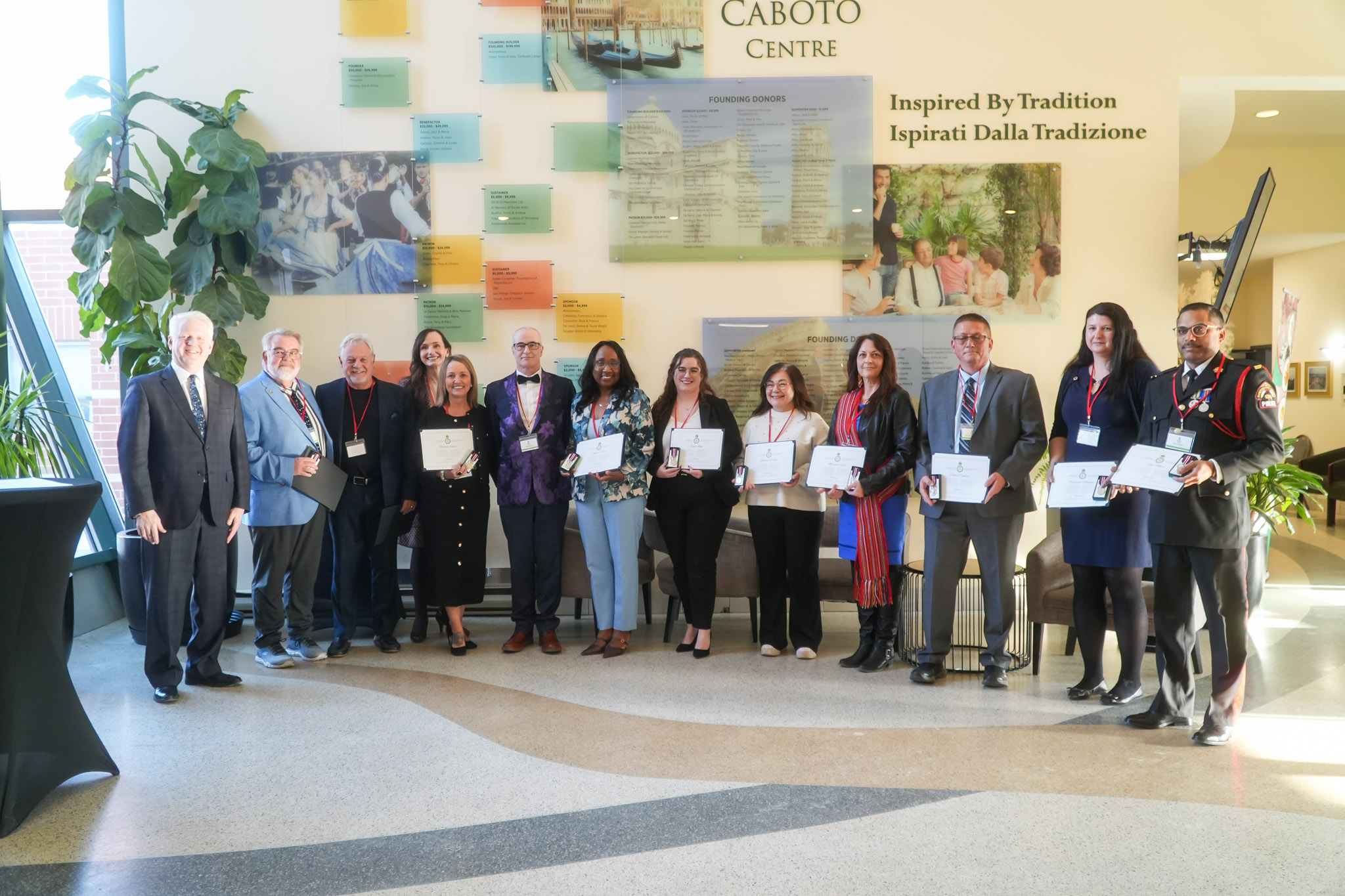 Recipients of the 2025 King Charles III Coronation Medal in Winnipeg, smiling proudly with the medals displayed