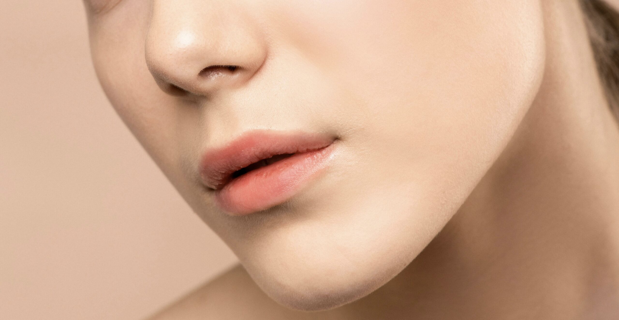 Client receiving lip blushing treatment