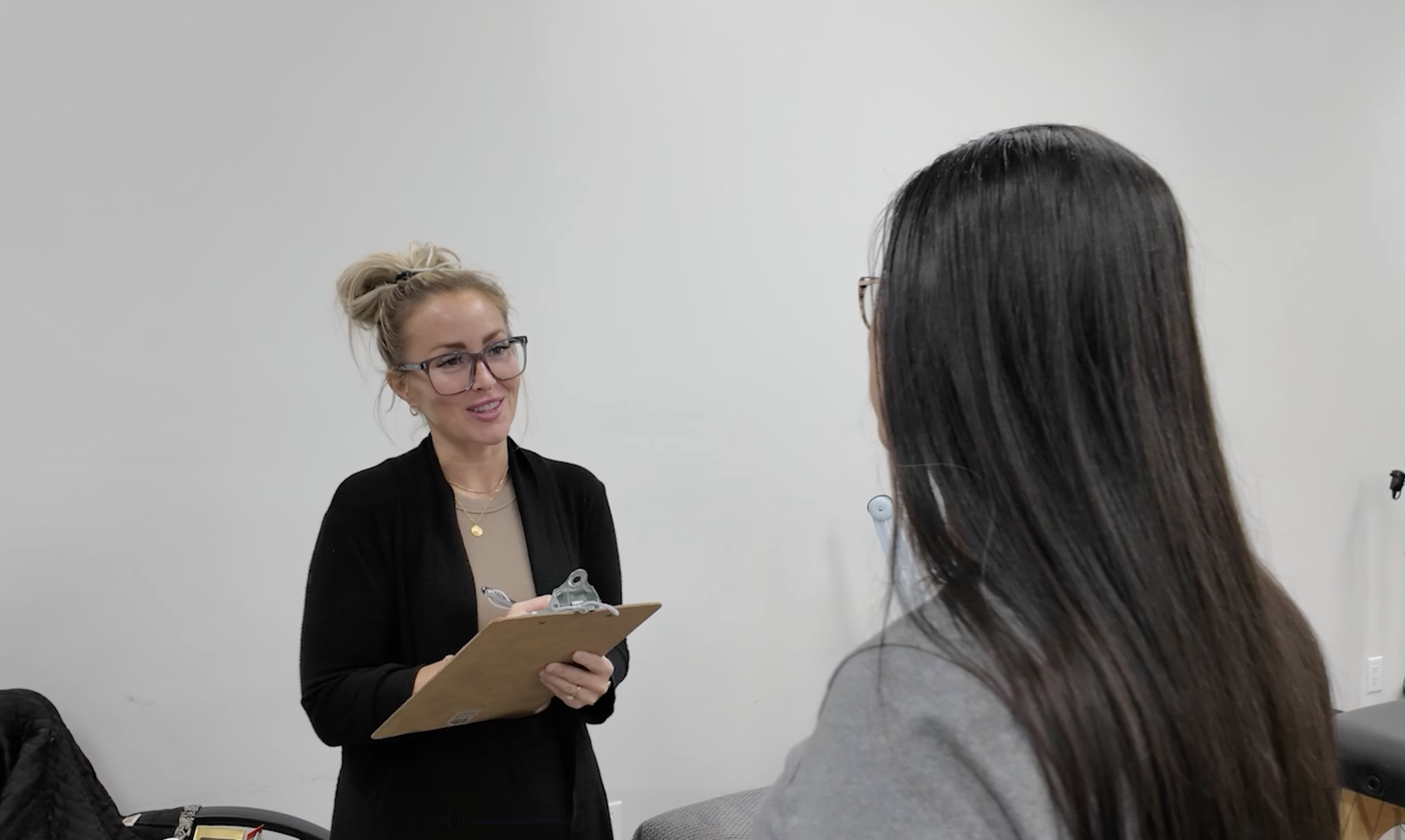 client consultation during a demonstration course at a beauty school in Winnipeg